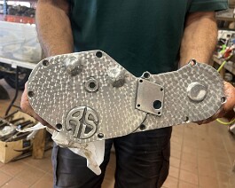 The finished "engine turn" process as applied on the cam cover.